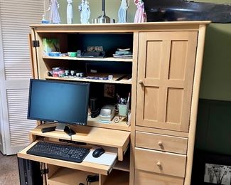Desk/armoire unit.
