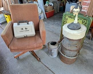 Vintage rolling desk chair, milk jugand watering can. 