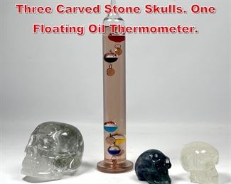 Lot 61 4pc Modern Design Lot. Three Carved Stone Skulls. One Floating Oil Thermometer. 