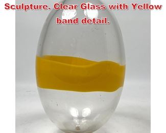 Lot 62 Large Art Glass Egg form Sculpture. Clear Glass with Yellow band detail. 