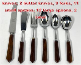 Lot 65 Bakelite flatware set. 11 knives, 2 butter knives, 9 forks, 11 small spoons, 12 large spoons, 2 smal