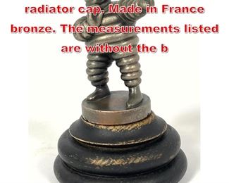 Lot 94 Bibendum Michelin man radiator cap. Made in France bronze. The measurements listed are without the b