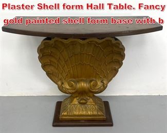 Lot 98 Grosfeld House style Carved Plaster Shell form Hall Table. Fancy gold painted shell form base with b