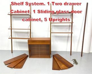 Lot 291 Danish Modern Teak Wall Shelf System. 1 Two drawer Cabinet, 1 Sliding glass door cabinet, 5 Uprights