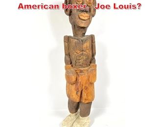 Lot 423 Folk Art carving of African American boxer. Joe Louis