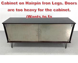 Lot 434 Modernist Steel Door Cabinet on Hairpin Iron Legs. Doors are too heavy for the cabinet. Wants to fa