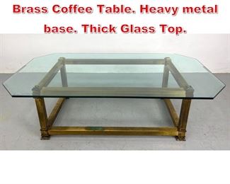 Lot 503 Mastercraft Style Glass and Brass Coffee Table. Heavy metal base. Thick Glass Top. 
