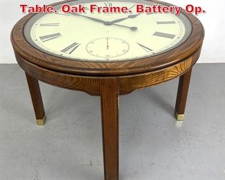 Lot 517 Howard Miller Clock Center Table. Oak Frame. Battery Op.