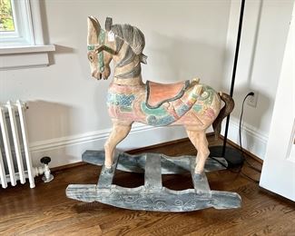 Carved wooden rocking horse