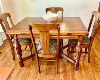 Antique table with extendable breadboard ends and 4 chairs