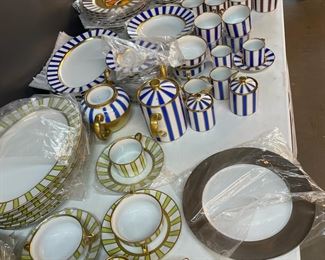 Hand painted gold porcelain dinnerware by Marc Blackwell
