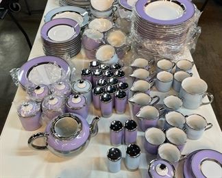 Hand painted gold and platinum dinnerware by Marc Blackwell