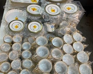 Hand painted gold and platinum dinnerware by Marc Blackwell