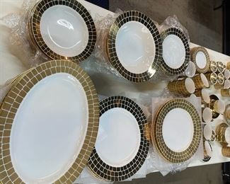 Polished and burnished gold dinnerware by designer Marc Blackwell