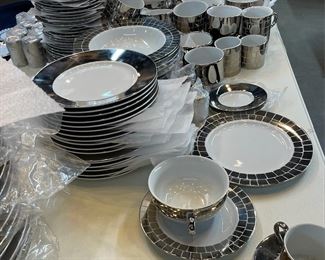 Polished and burnished platinum dinnerware by designer Marc Blackwell