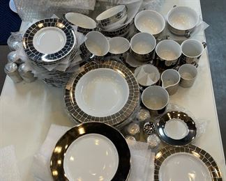 Polished and burnished platinum dinnerware by designer Marc Blackwell