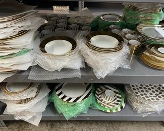 Hand painted gold and platinum dinnerware by Marc Blackwell