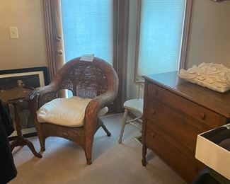 wicker chair and maple dresser