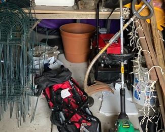 baby stroller and two gas trimmers