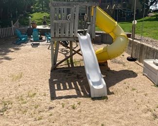 playground  set  with swings and rings and two slides