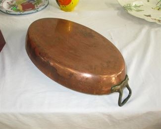One of two large copper  pans