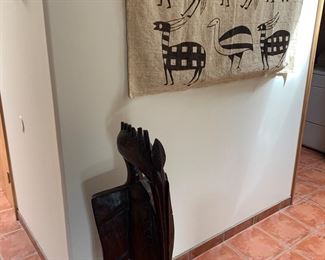 Senufo prosperity bird figure and African mud-cloth wall hanging