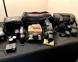 Nikon, Minolta, Canon SLR and film cameras, and Sony cam corder. 