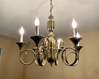 Brass "horn" chandelier. Must be removed by a professional.