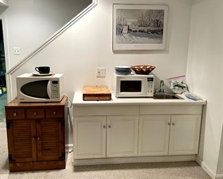 Two of the three microwaves available at this sale.