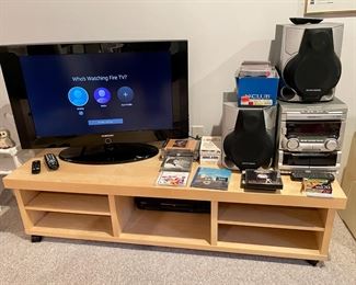 Samsung working flat-screen TV and Philips Magnavox CD/tape deck/radio portable stereo.
