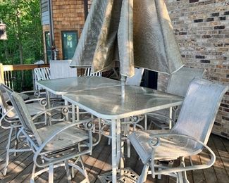 Outdoor Patio Set 
2 High Top Tables 
6 Chairs
1 Umbrella 
1 Cast Iron Umbrella Stand 
