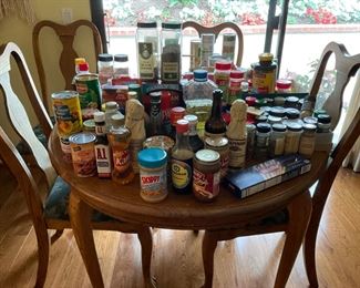 Food and spices on oak table with claw feet