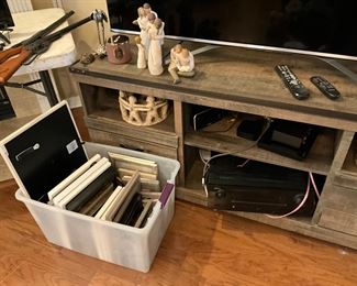 Left view up close of entertainment table - frames in container