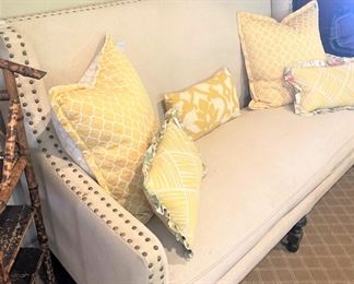 Sofa  with nail-head trim; yellow accent pillows