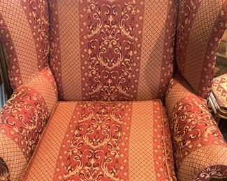 One of two matching wingback chairs