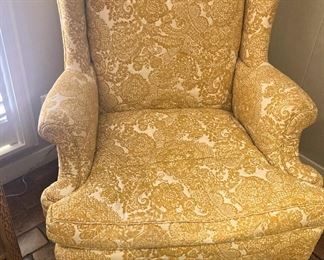 One of two matching wingback chairs; needlepoint foot stool