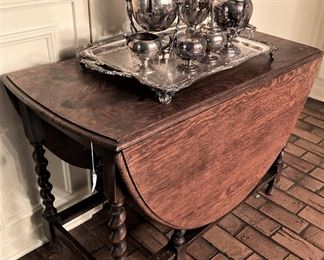 Antique drop leaf barley twist table; silver plate coffee service