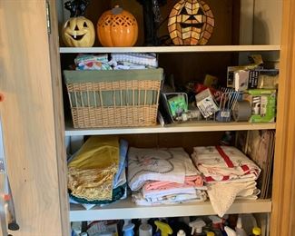 Cleaning supplies, stained glass pumpkin, linens 