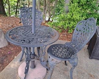 Cast iron patio set and umbrella