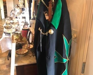 Clergy robe - one of several. Hanging on an oak hall tree.