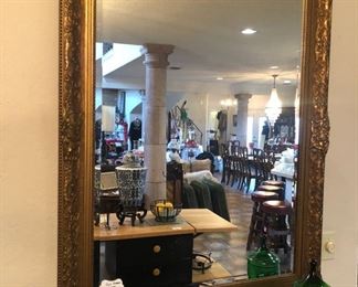 Elegant formal beveled glass wall mirror.