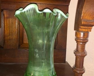 We have a pair of these beautiful vintage green glass vases.