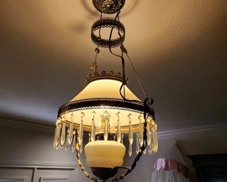 Electrified antique hanging oil lamp in the master bedroom. 