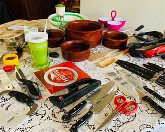 many brand new Pampered Chef kitchen gadgets and Kitchen Aid knives