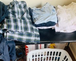 large assortment of Ascension Day School girls' uniforms. Sizes range from Large girl's sizes to smaller women's sizes and some larger Junior sizes