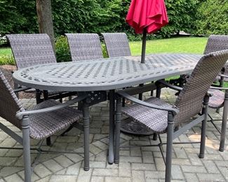 Outdoor Dining Table and 8 Metal & Woven All-Weather Wicker Dining Chair Set.