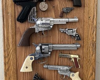 VINTAGE CAP GUNS / PISTOLS MOUNTED ON BOARD