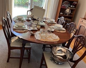 Dining Table
8 shield back chairs with Prince of Wales Feathers  and needlepoint chairs 