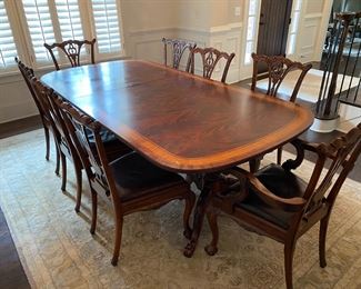 Mahogany dining table, 8 Chippendale chairs with leather seats