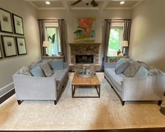 2 Bassett formal couches, 2 silver distressed wood chests (Coffee table and lamps shown are not included.) See additional photos for chests